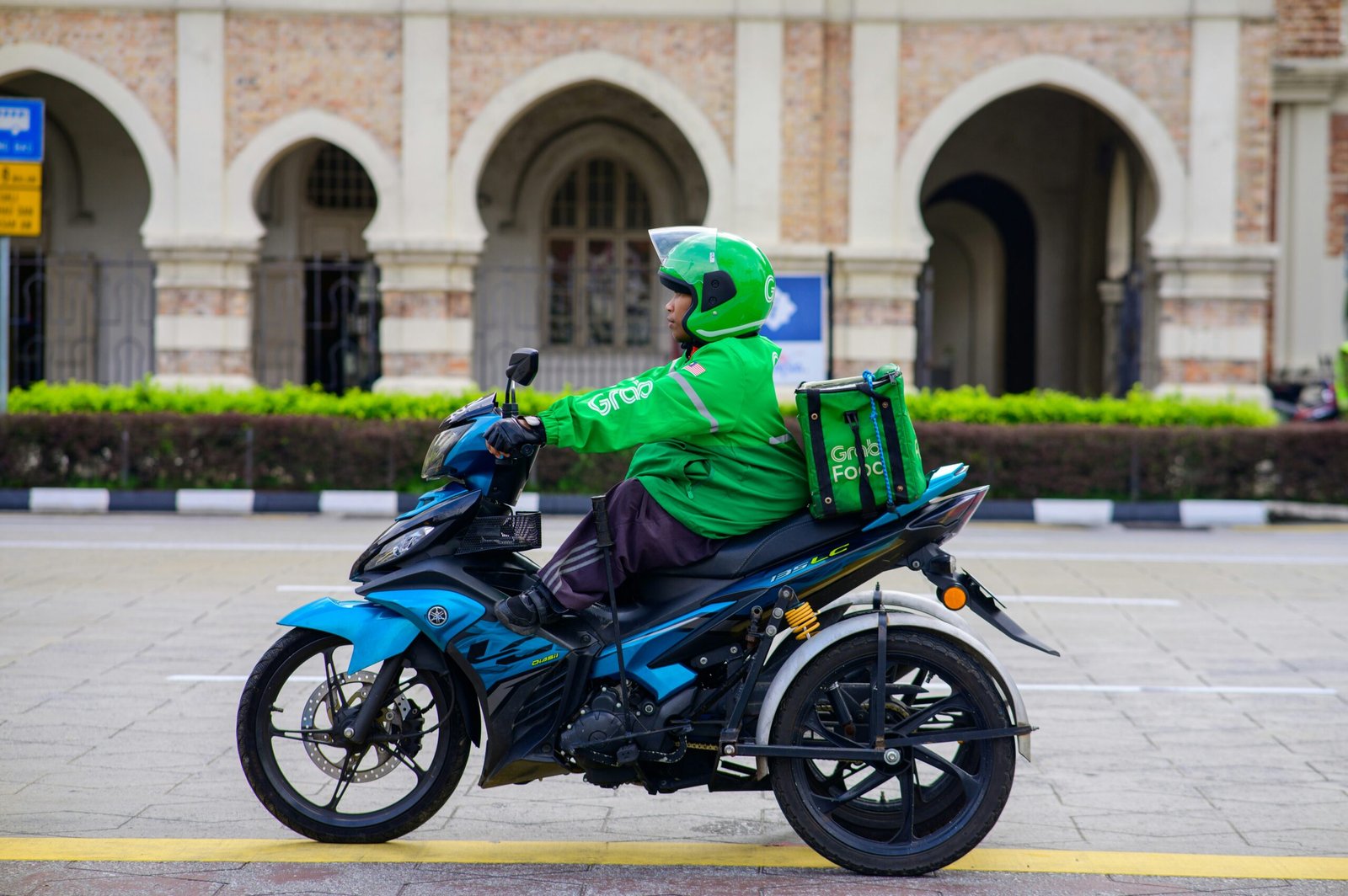men riding a bike picture